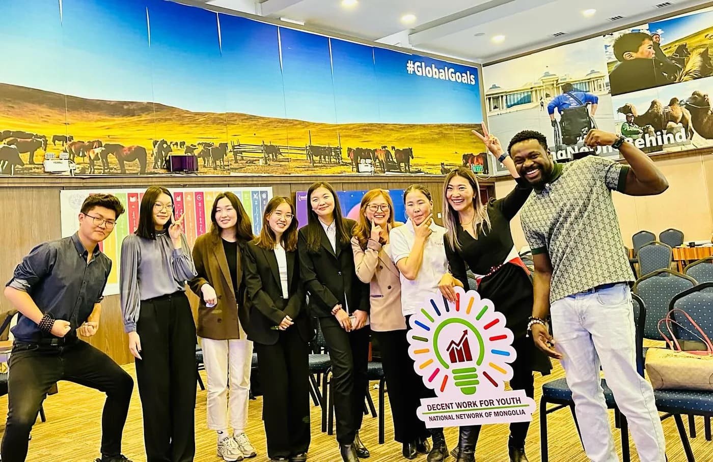 Group photo in front of a Global Goals backdrop